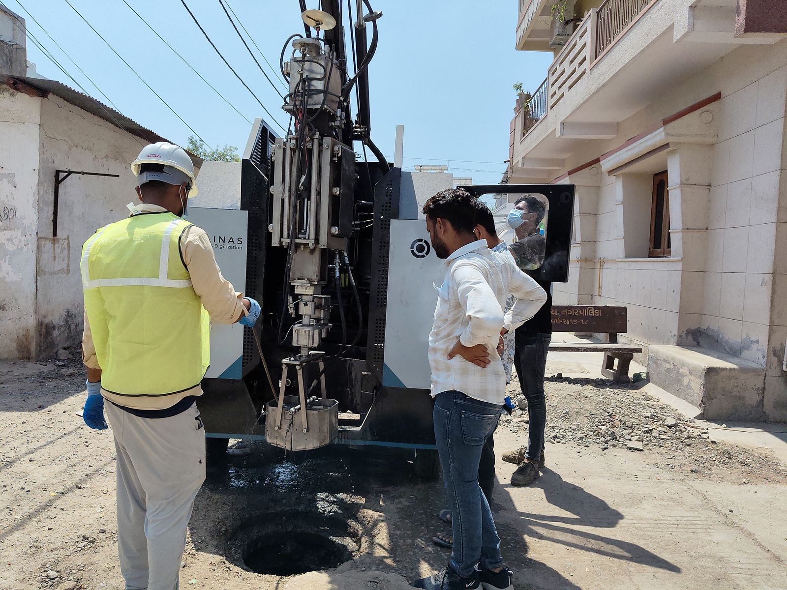 A robotic machine cleaning a sewer manhole