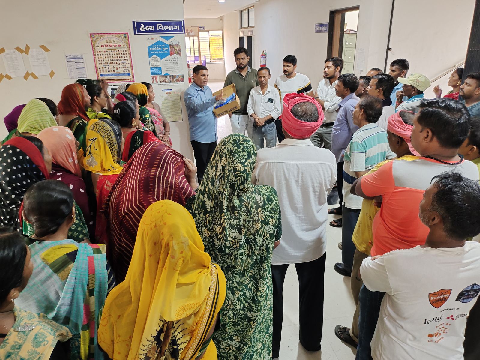 Sanitation workers at a meeting with civic officers
